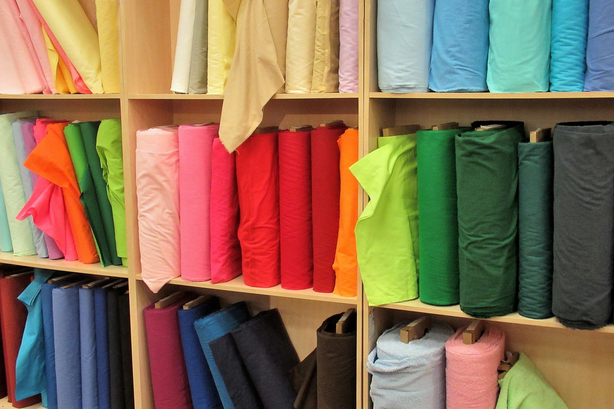 Colorful fabric rolls in a textiles store
