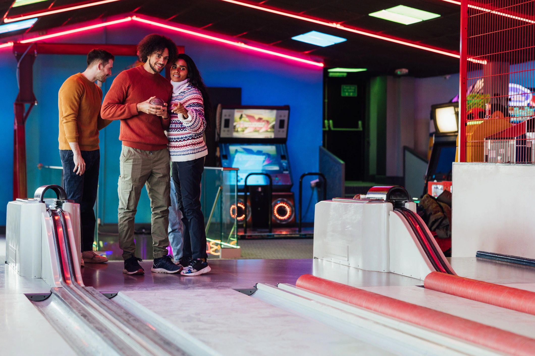 Friends enjoying games at an arcade