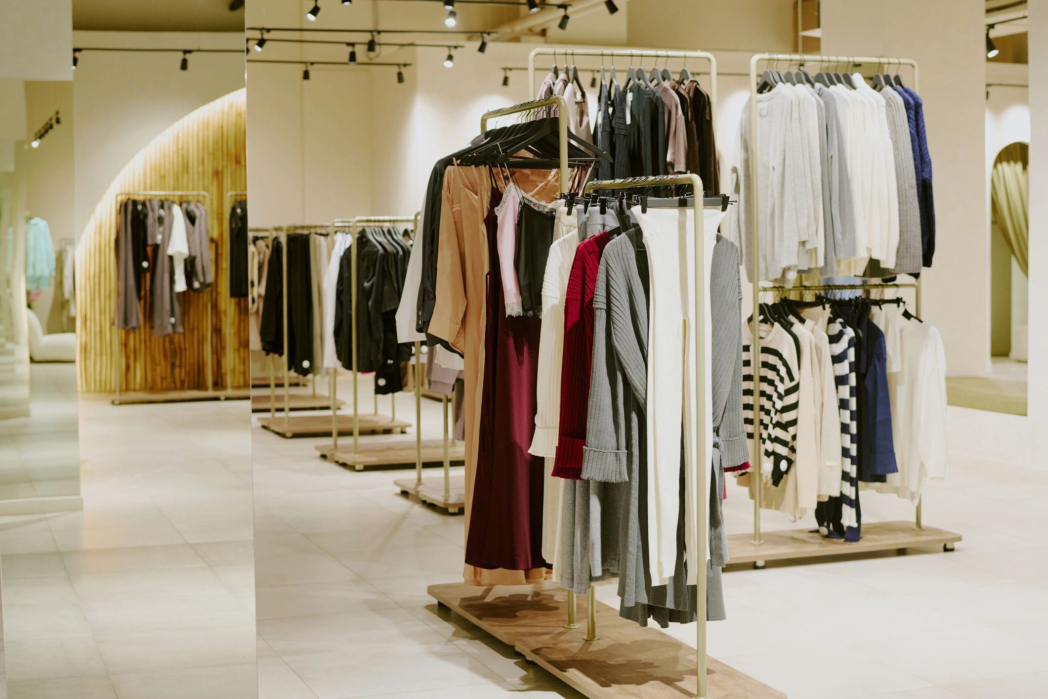 Boutique with designer clothing on hangers