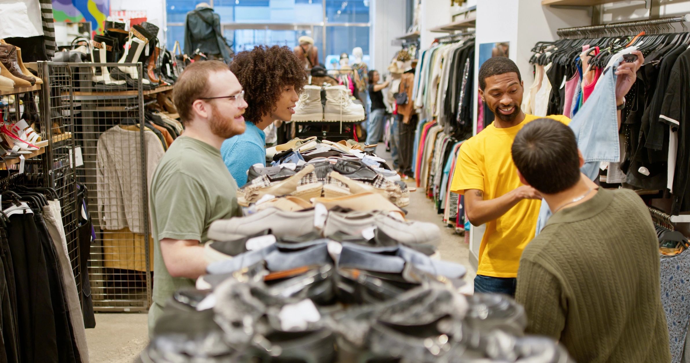 Shoppers browsing clothing in a retail store